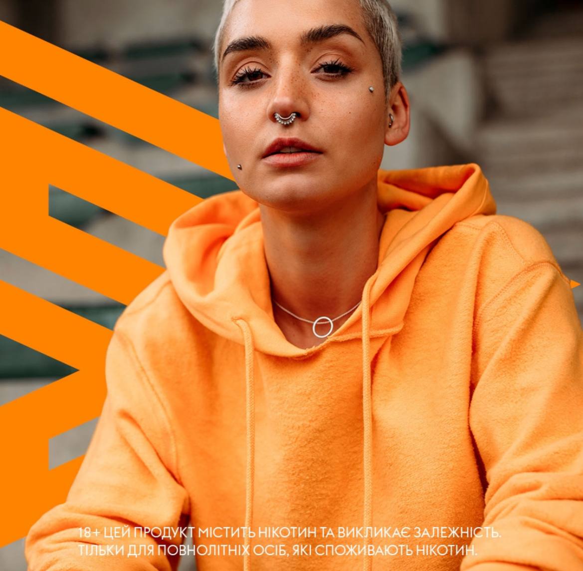 Girl in orange hoodie with VELO